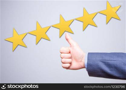 Review, rating, ranking, evaluation and classification concept. Businessman is satisfied with company 5 stars rating. Isolated on white