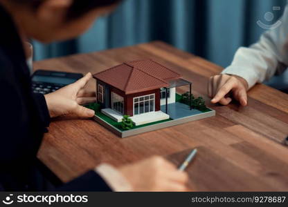 Reviewing house loan contract with agent. Analyzing financial documents and tax rates with calculator for ownership of property. Key signature for new home purchase and financing. Enthusiastic. Reviewing house loan contract with agent using calculator. Enthusiastic