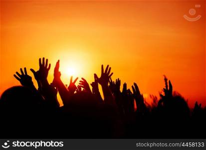 Revolution, people protest against government, man fighting for rights, silhouettes of hands up in the sky, threat of war