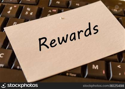 Rewards concept on black keyboard background