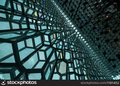 Reykjavik, Iceland - July 3, 2018 : Detailed view of Harpa building architecture which is a complex of concert hall, theater and conference center with unique design located in Reykjavik, Iceland.