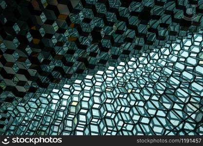 Reykjavik, Iceland - July 3, 2018 : Detailed view of Harpa building architecture which is a complex of concert hall, theater and conference center with unique design located in Reykjavik, Iceland.