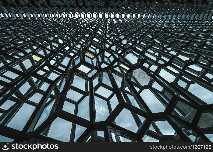 Reykjavik, Iceland - July 3, 2018 : Detailed view of Harpa building architecture which is a complex of concert hall, theater and conference center with unique design located in Reykjavik, Iceland.