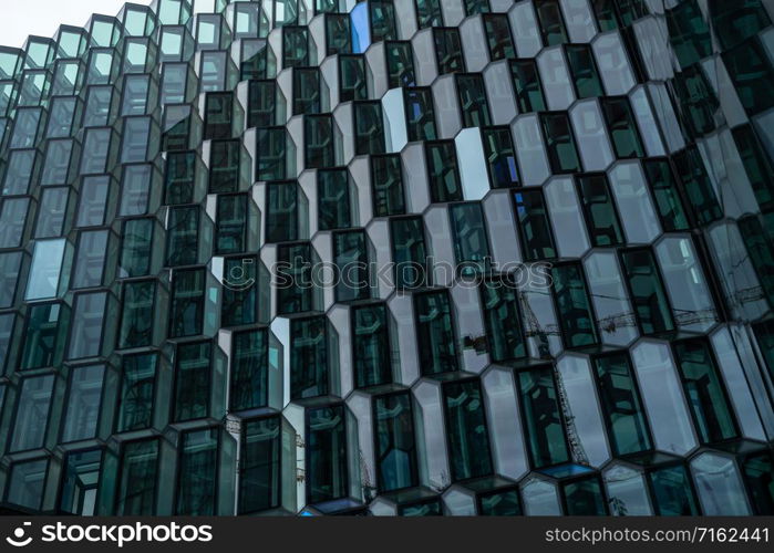 Reykjavik, Iceland - July 3, 2018 : Detailed view of Harpa building architecture which is a complex of concert hall, theater and conference center with unique design located in Reykjavik, Iceland.