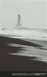 Reynisfjara beach beauty monochrome landscape photo. Beautiful nature scenery photography with sky on background. Idyllic scene. High quality picture for wallpaper, travel blog, magazine, article. Reynisfjara beach beauty monochrome landscape photo