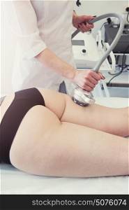 rf lifting procedure. Body treatment: woman getting rf lifting procedure to her buttocks