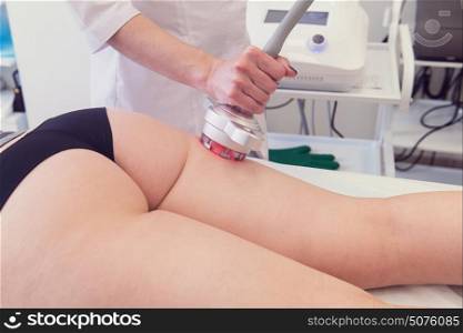 rf lifting procedure. Body treatment: woman getting rf lifting procedure to her buttocks