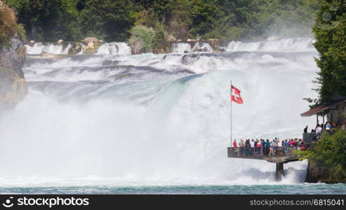 RHEINFALLS, SWITZERLAND - JULY 25, 2015: View to the biggest waterfalls of Europe in Schaffhausen, Switzerland on May 17, 2015. They are 150 m (450 ft) wide and 23 m (75 ft) high.