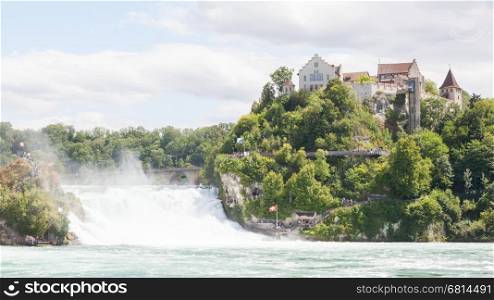 RHEINFALLS, SWITZERLAND - JULY 25, 2015: View to the biggest waterfalls of Europe in Schaffhausen, Switzerland. They are 150 m (450 ft) wide and 23 m (75 ft) high, july 25, 2015.