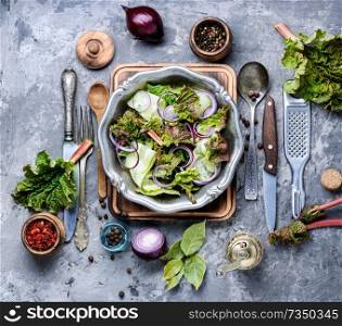 Rhubarb salad.Vegetarian spring salad.Vegetables salad in salad bowl.Healthy food. Spring vegetable salad
