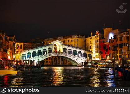 Rialto Bridge (Ponte Di Rialto) in Venice, Italy at night time