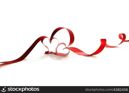 Ribbons shaped as hearts on white, valentines day concept