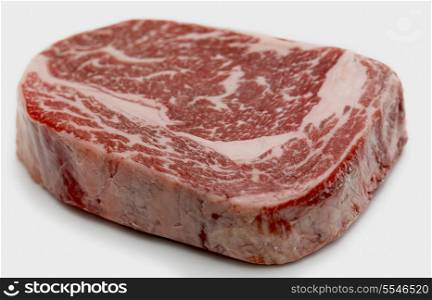 Ribeye steak from Australian Wagyu cattle. This is fram a Japanese breed of cattle which are famed for heavy marbling and high proportion of unsaturated fats, which make it low in cholesterol. It is a gourmet item and is one of the most expensive kinds of beef. Shallow depth of field.