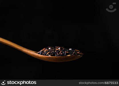 rice berry in wooden spoon