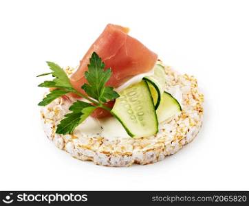 Rice cakes with cream cheese, prosciutto and cucumber isolated on white background. Rice cakes with cream cheese, prosciutto and cucumber