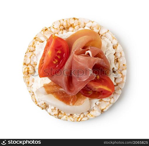 Rice cakes with cream cheese, prosciutto and tomato top view isolated on white background. Rice cakes with cream cheese, prosciutto and tomato