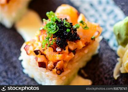Rice Cube Sushi topped with spicy tako (octopus)