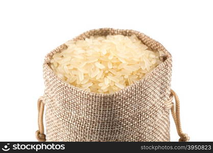 Rice in a sack and spilled on a white background