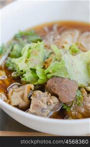 rice noodle soup. rice noodle soup with pork and vegetables