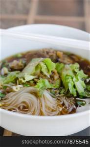 rice noodle soup. rice noodle soup with pork and vegetables