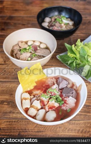 rice noodle spicy soup with pork and vegetables. rice noodle soup with pork and vegetables