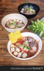 rice noodle spicy soup with pork and vegetables. rice noodle soup with pork and vegetables