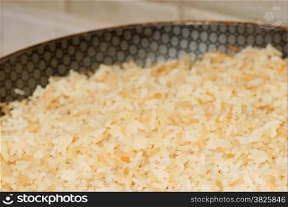 rice on frying pan, skillet