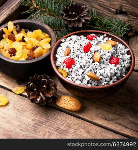 rice porridge with nuts and raisins. national Russian Christmas dish, a porridge with raisins and almonds, kutya