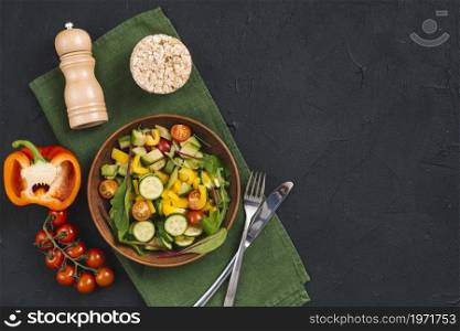 rice puffed cake vegetables salad pepper shakers napkin black concrete textured backdrop. High resolution photo. rice puffed cake vegetables salad pepper shakers napkin black concrete textured backdrop. High quality photo