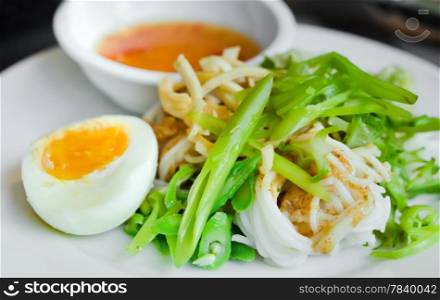 rice vermicelli served with boiled egg, vegetable and sweet sauce