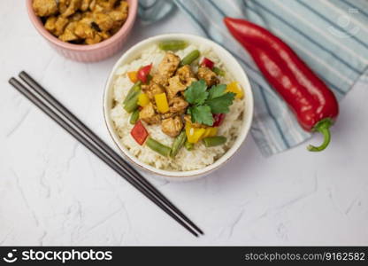 rice with vegetables and meat kung pao asian dish side dish with pork or beef on a plate for restaurant menu