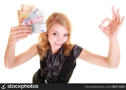 Rich happy blonde business woman showing euro currency money banknotes, giving ok hand sign gesture. Economy, finance business work.