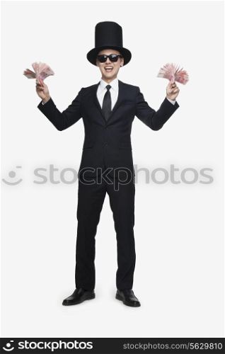 Rich Man Holding Two Stacks of Money