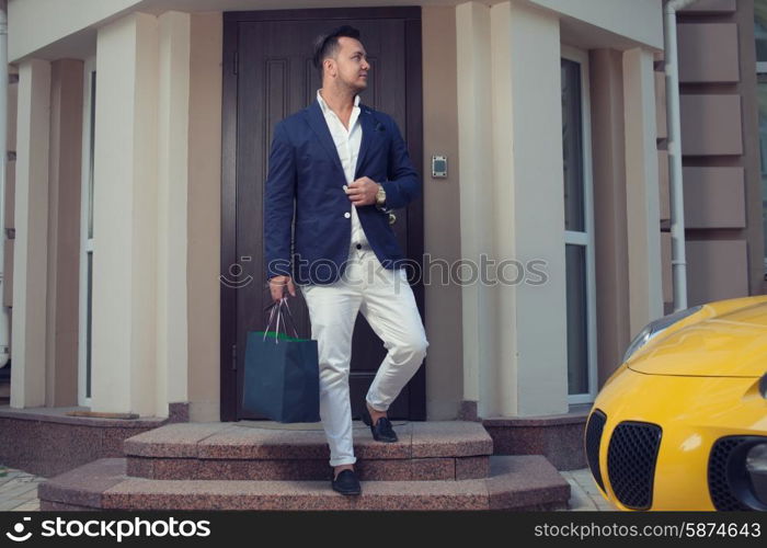 Rich man leaving house