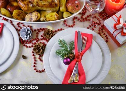 rich table setting for Christmas dinner