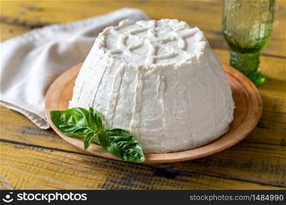 Ricotta an Italian whey cheese with fresh basil leaves
