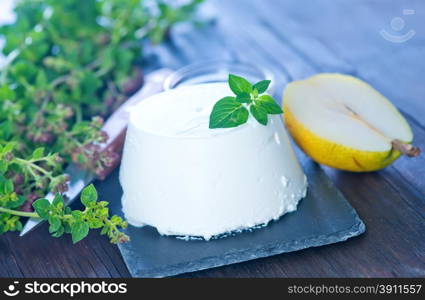 ricotta cheese with fresh pear on a table