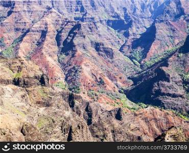 Ridges of Waimea Canyon showcase the rugged volcanic terrain. The canyo on the island of Kauai is the deepest canyon in the state of Hawaii.