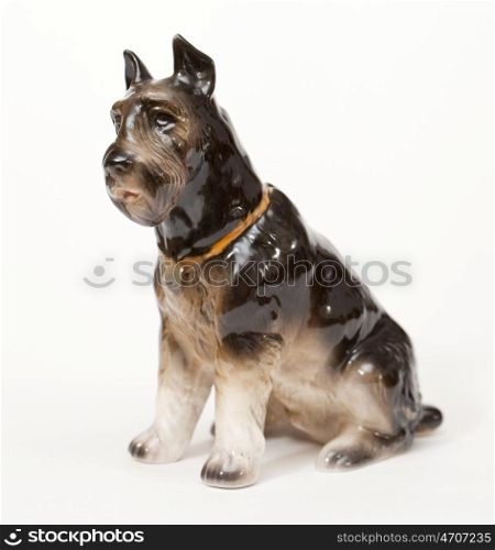 Riesenschnauzer. Ceramic figurine, dog breed isolated on white