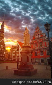 Riga Church of St. Peter and the streets of the ancient city. The red moon is shining.. Riga Church of St. Peter