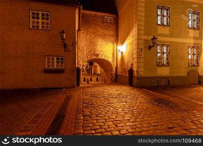 Riga. Old street at night.. Old medieval street in the historic center of Riga at night.
