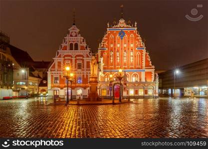 Riga. Town Square at night.. Town Hall Square and the House of the Blackheads in Riga's historic center.