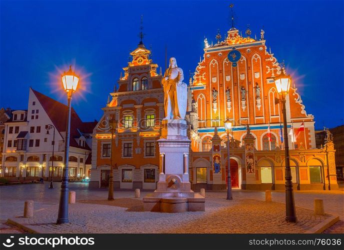 Riga. Town Square at night.. Town Hall Square and the House of the Blackheads in Riga's historic center.