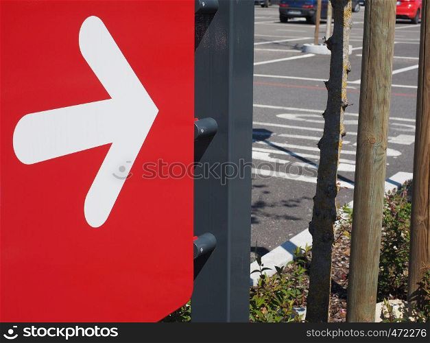 right direction arrow sign in white over red background. right direction arrow sign