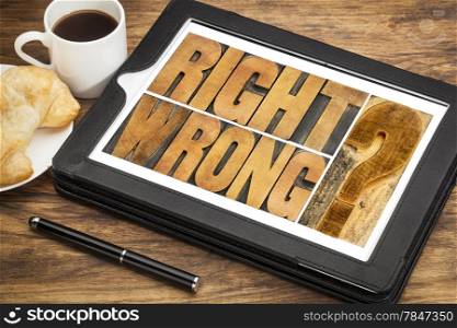 right or wrong ethical choice dilemma - word abstract in wood letterpress printing blocks on a digital tablet