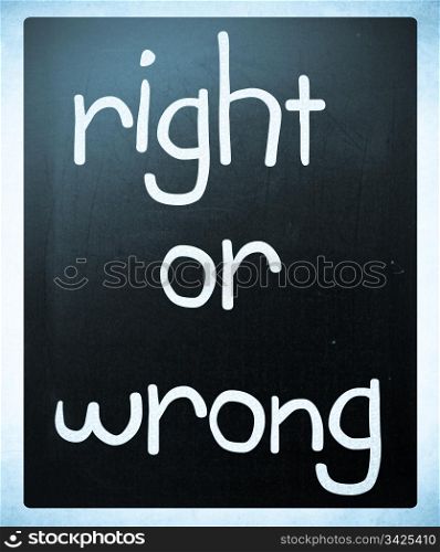 ""Right or wrong" handwritten with white chalk on a blackboard"