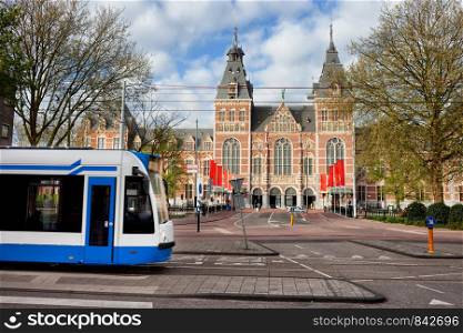 Rijksmuseum and tram on Weteringschans street in the city of Amsterdam, Netherlands, North Holland.