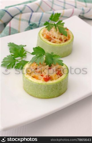 Ring of zucchini stuffed with vegetables with rice and cheese