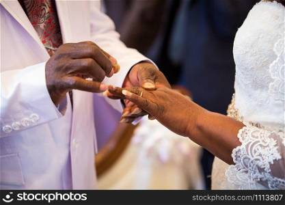 Rings exchange for black couple marriage ceremony. Rings exchange for black couple marriage