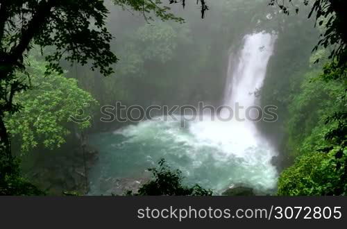 Rio Celeste (Blue River) waterfall in Tenorio Volcano National Park, Costa Rica, Central America. Nature, wilderness, natural landscape, environment protection, jungle, forest, rainforest, trees